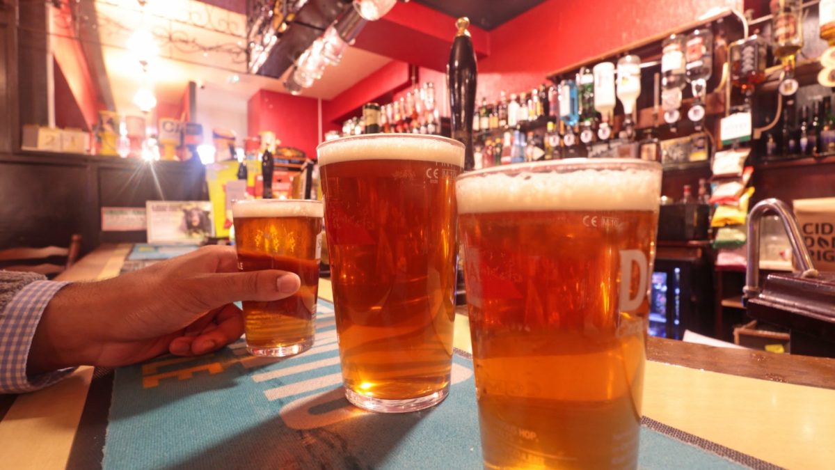 glasses of Real ale beer on bar in traditional English pub