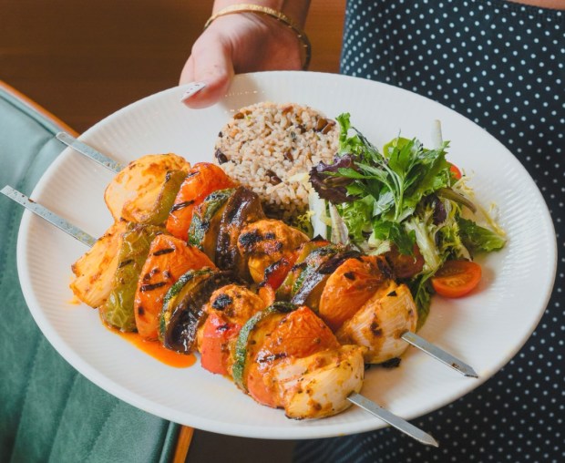The modern-Turkish restaurant Divan opened in summer 2026 in Berkeley, Calif. Pictured: vegetable-kebab plate. (Photo by @cariavisuals, courtesy of Divan)