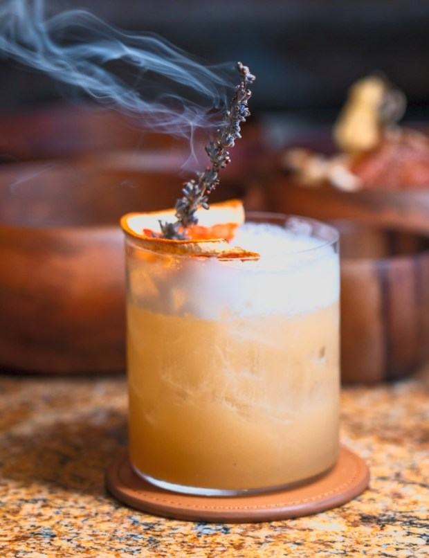 The modern-Turkish restaurant Divan opened in summer 2026 in Berkeley, Calif. Pictured: The Bosphorus Smoke cocktail. (Photo by @cariavisuals, courtesy of Divan)