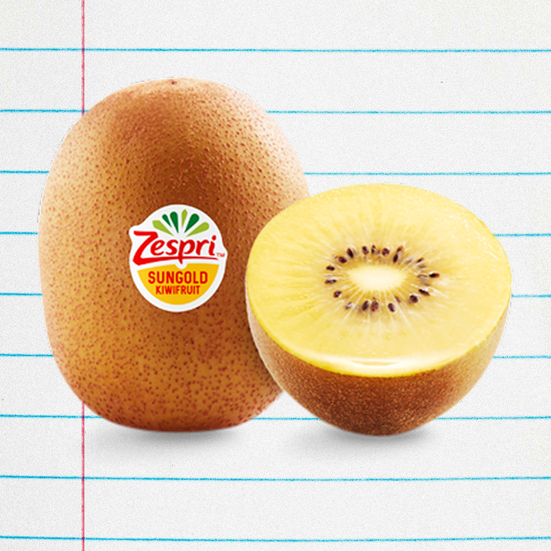 Sungold kiwifruit with a label, whole fruit beside a halved fruit, showcasing the golden flesh and seeds.