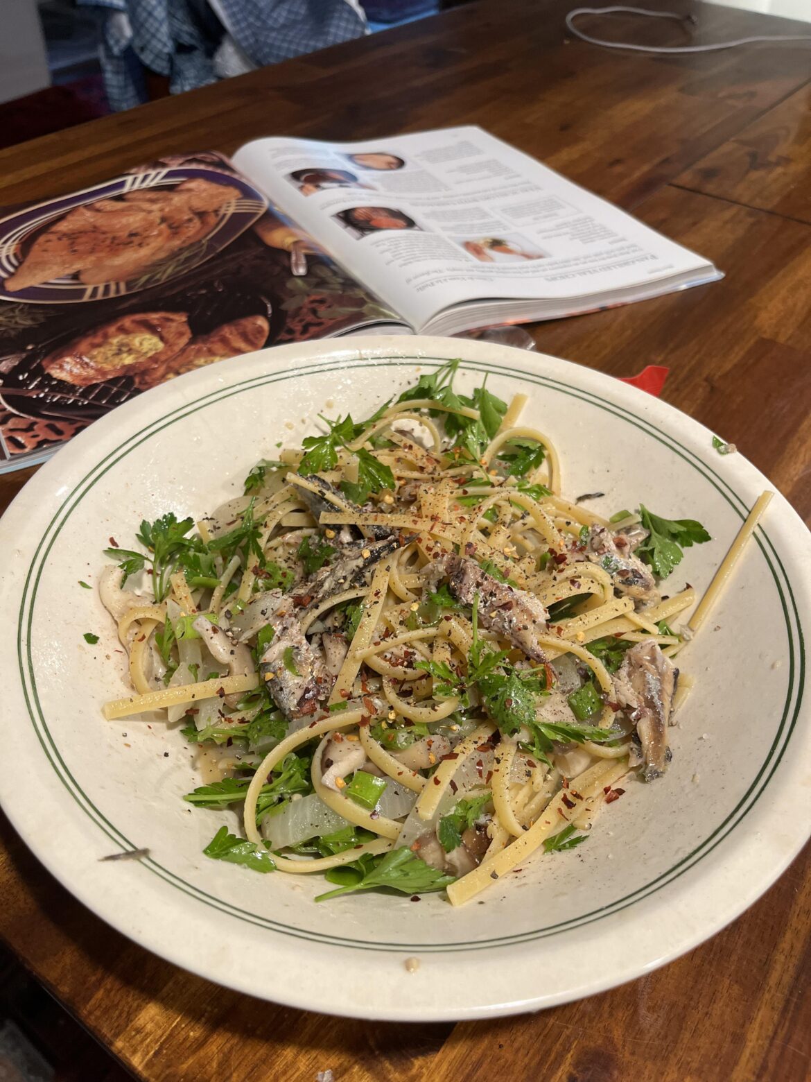 Sardines tossed in white wine garlic & chili with linguini and Italian parsley