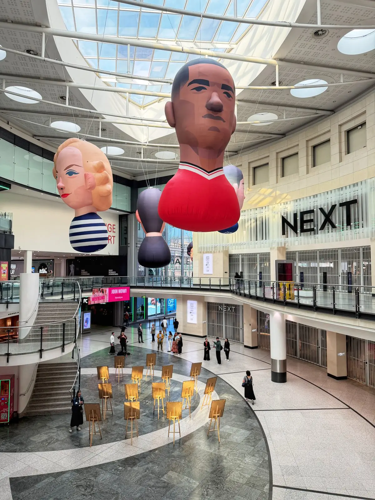 Stanley Chow inflatable portraits in Manchester Arndale. Credit: The Manc Group