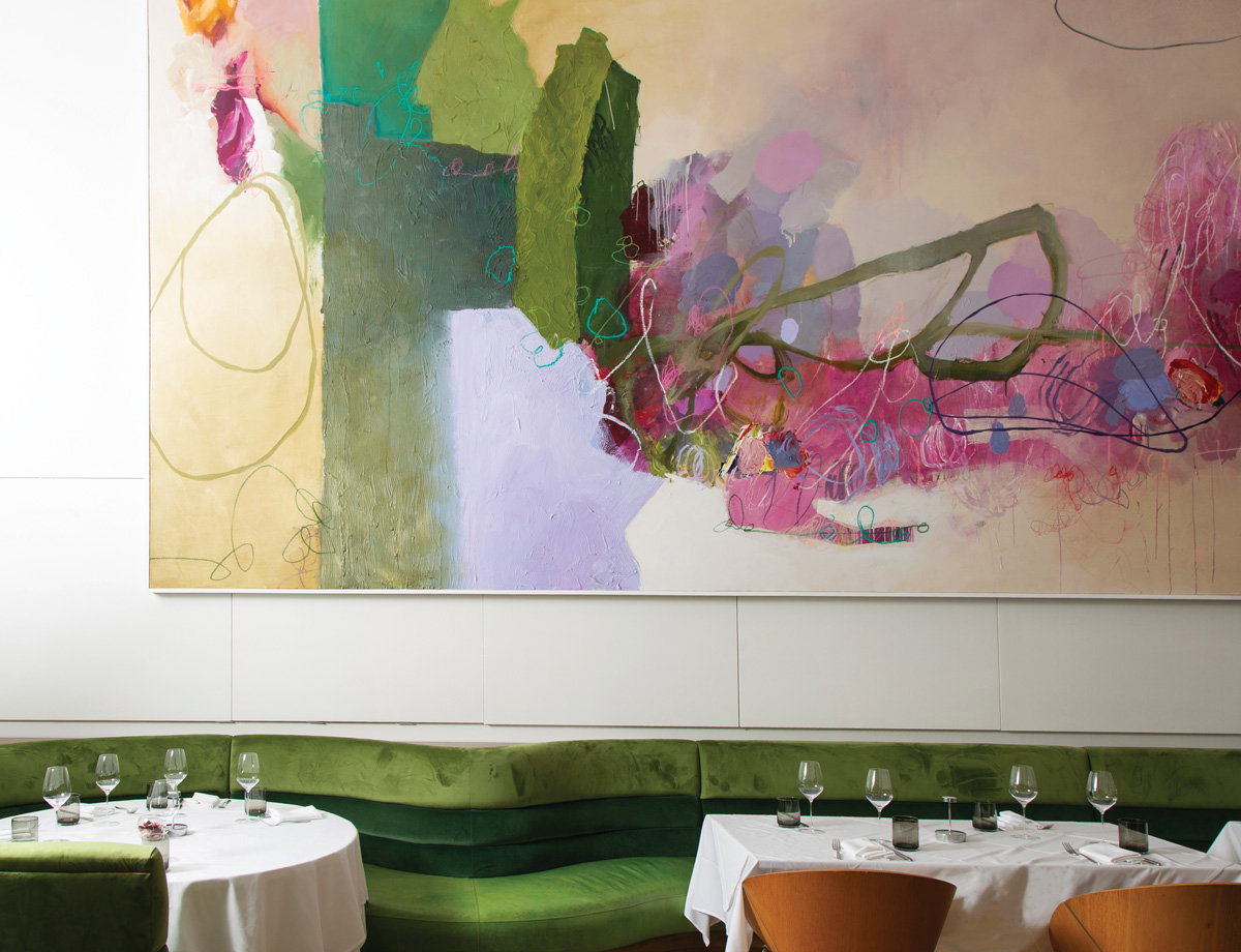 An abstract painting by Tommy Taylor defines the main dining room