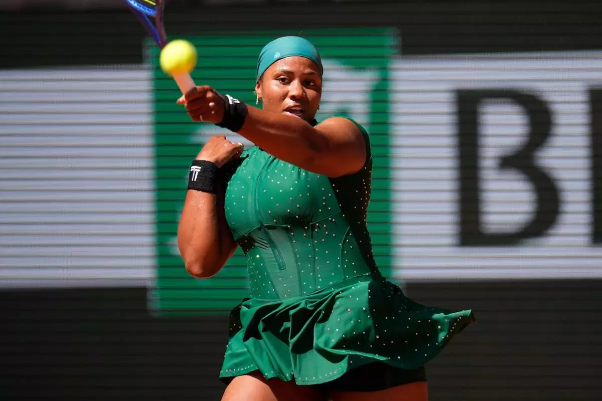 Taylor Townsend of the U.S. returns to Coco Gauff of the U.S. during their first round women's singles tennis match at the French Open tennis tournament in Paris, Tuesday, May 26, 2026. (AP Photo/Christophe Ena)