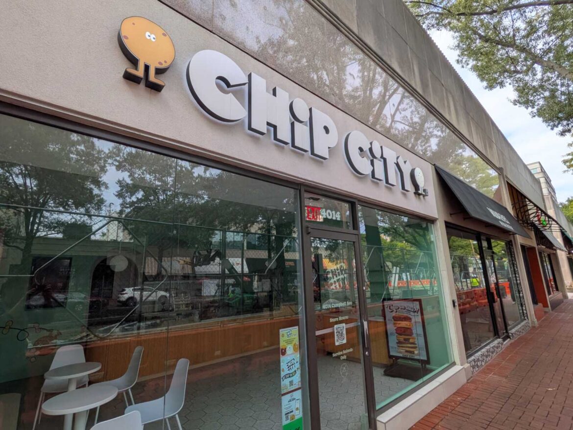 Chip City closes cookie shops in Clarendon and Shirlington Chip City storefront with a cookie-shaped logo on a beige facade and glass windows reflecting trees.
