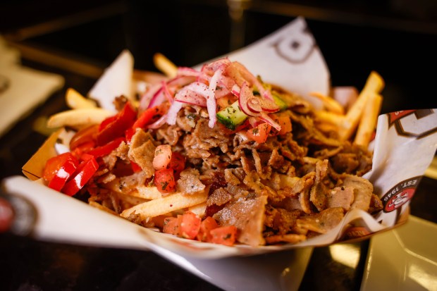 Beef/lamb Hella Fries, halal beef/lamb gyro over fries, topped with cheese, Afghan chopped salad, sumac onions, cherry peppers, and tzatziki, is on display at the San Francisco 49ers' Annual Concessions Showcase at Levi's Stadium in Santa Clara, Calif., on Wednesday, Sept. 16, 2026. (Shae Hammond/Bay Area News Group)