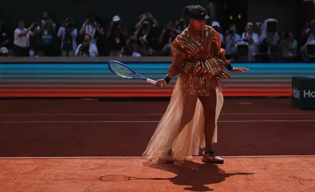 Naomi Osaka of Japan prepares for the third round women's singles tennis match against Iva Jovic of the U.S. at the French Open tennis tournament in Paris, Saturday, May 30, 2026. (AP Photo/Thibault Camus)