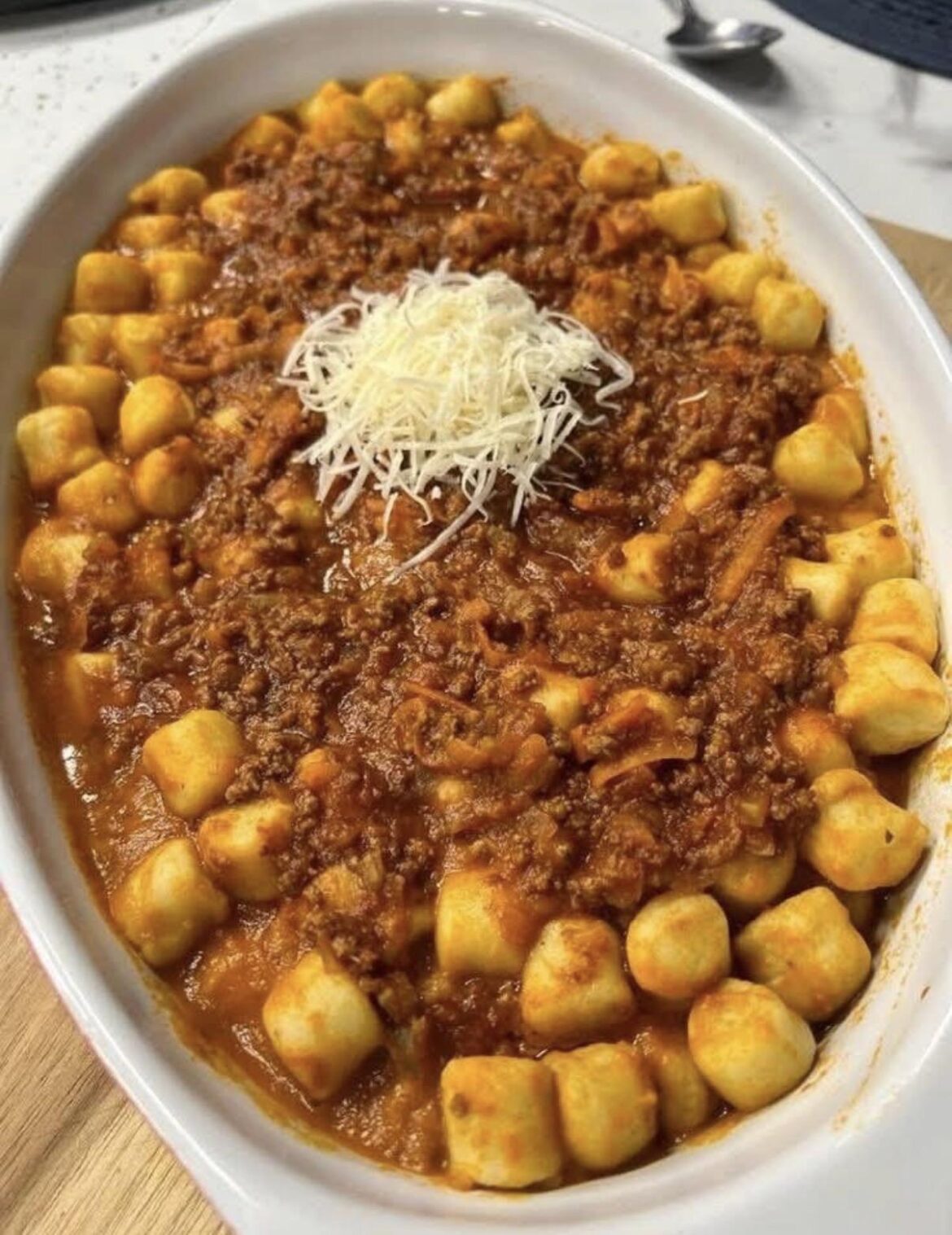 Gnocchi with homemade meat sauce and cheese